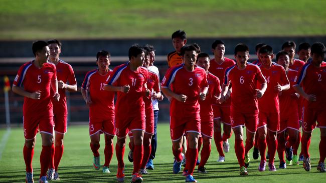 Members of the North Korea football team during a training session at Leichhardt Oval ahead of their opening Asian Cup match. Picture: Richard Dobson