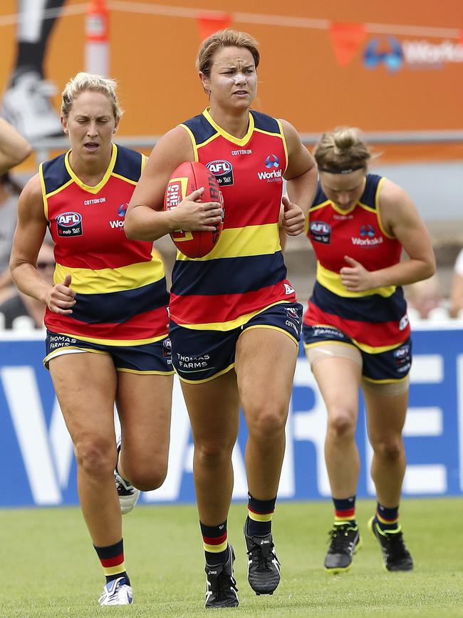 With her teammates during the Crows successful 2019 season. Picture: SARAH REED