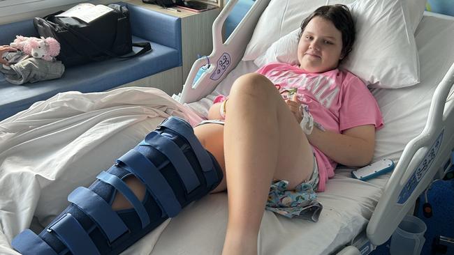 Jaydah Duggan-Ford had her stay in hospital on Christmas Day brightened by a visit by Andy Baxter (Santa hat, below) and his team of volunteers. Pictures: Bridget Clarke