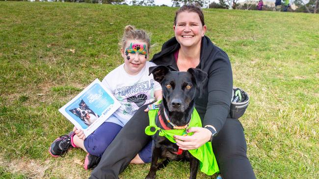 Dog walkers Evie Miller, aged 7, and Kat Duncan with dog Molly at the million paws walk at Queens Domain in Hobart in Sunday 25th May 2025. Picture: Linda Higginson