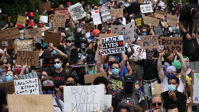 Protesters march down Washington’s Constitution Avenue, near the White House, on Sunday (AEST). Picture: AFP