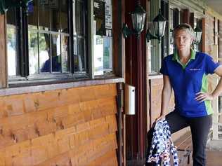 Walloon Saloon manager Dannilee Killin stands on the pub's verandah with discarded police tape. The hotel was broken into four times in the last week. On Saturday night hotel residents disturbed the thieves who threw a glass bottle injuring a man. . Picture: Claudia Baxter