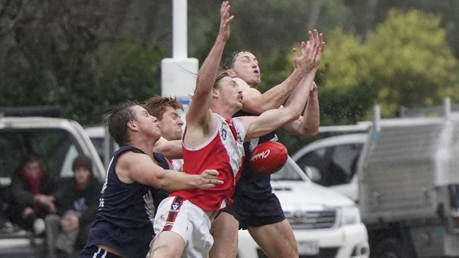 MPNFL: Edithvale-Aspendale and Red Hill players vie for the mark. Picture: Valeriu Campan