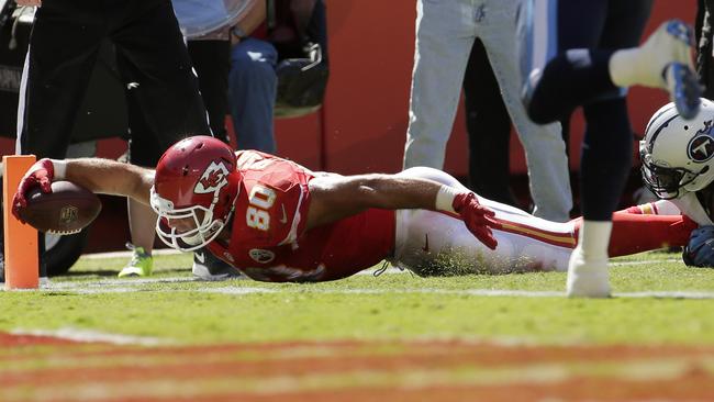 Kansas City Chiefs tight end Anthony Fasano (80) scores on a 5-yard touchdown reception in front of Tennessee Titans safety Michael Griffin (33) in the second half of an NFL football game in Kansas City, Mo., Sunday, Sept. 7, 2014. (AP Photo/Charlie Riedel)