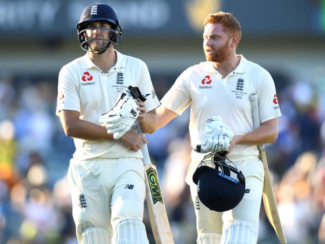 Dawid Malan (left) and Jonny Bairstow walk from the field after combining for a 174-run stand.