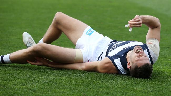 Geelong’s Aaron Black screams in pain after injuring his knee. Pic: Michael Klein