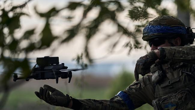 Pilots of the ‘Sharp Kartuza’ division of FPV kamikaze drones prepare drones for a combat flight in the Kharkiv region, 8km from the border with Russia. Picture: Getty Images