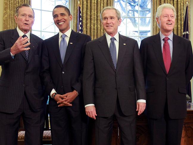 U.S. President George W. Bush with President-elect Barack Obama (2nd-L), former President Bill Clinton (2nd-R), and former President George H.W. Bush (L) are going.