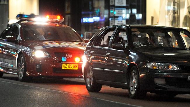 Police pull over a P plater on George Street in Sydney City.