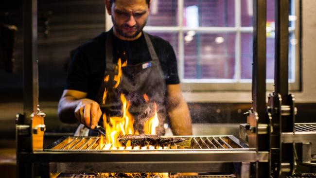 Firedoor’s Lennox Hastie at work over the grill. .