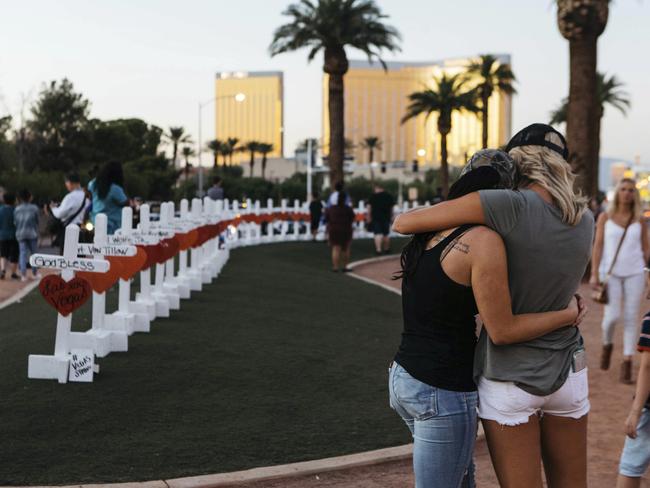 A memorial displaying 58 crosses by Greg Zanis stands at the "Welcome To Las Vegas Sign" in Las Vegas. Picture: AP