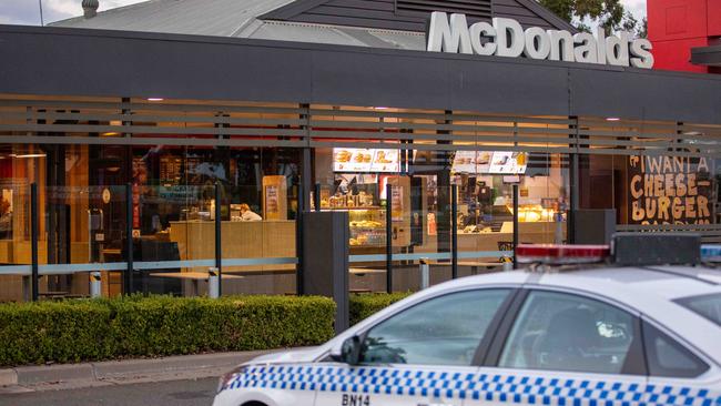 Police at Woodcroft McDonald’s after a man was stabbed while jogging nearby on Monday morning. Picture: Dean Asher