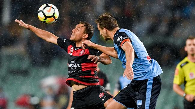 Brendon Santalab (left) of the Wanderers and Sydney FC’s Alex Wilkinson battle for possession during a derby clash at ANZ Stadium in February. The 2018 FFA Cup semi-final clash between Western Sydney and Sydney FC will be played at Panthers Stadium, Penrith. Picture: Brendan Esposito