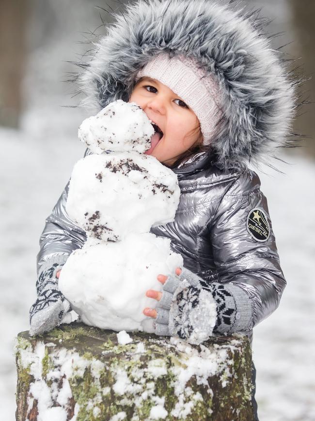 Willow Nicolosi, three, gets into the snow experience. Picture: Sarah Matray