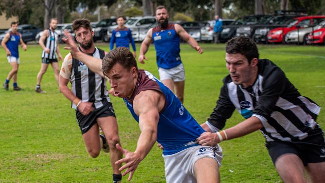 Old Peninsula's George Fletcher is tackled without the ball last season. Picture: Pearcey Photography