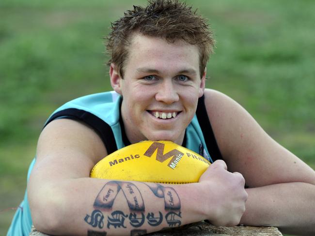 Darren Sheen picking up press after his goalkicking exploits for Cora Lynn.