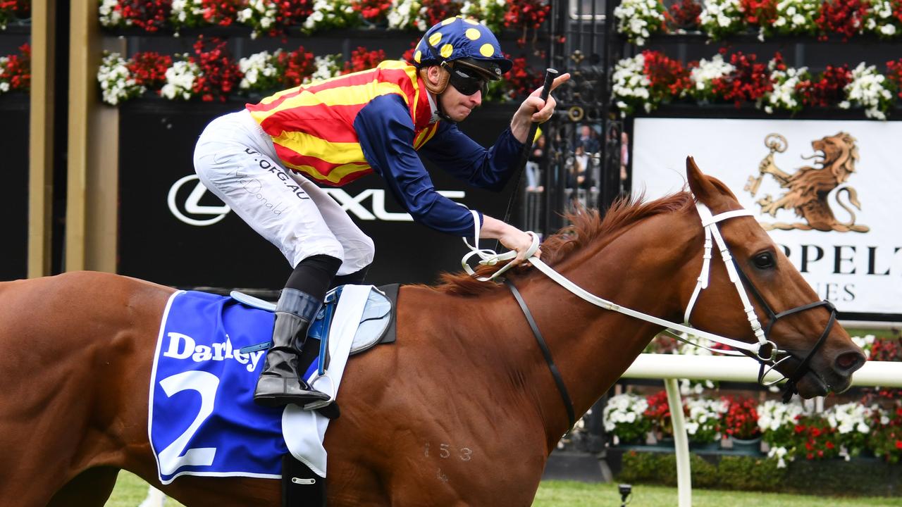 James McDonald salutes after riding Nature Strip to victory the Darley Sprint Classic. Picture: AAP/Vince Caligiuri