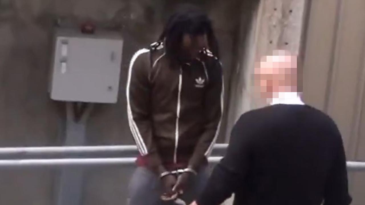 Chol Mathiang Apech is led into court on Tuesday. Picture: 7NEWS Adelaide