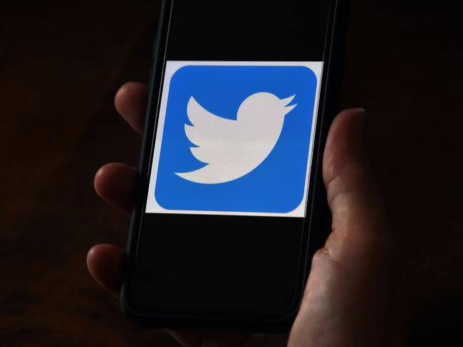 In this file photo illustration, a Twitter logo is displayed on a mobile phone on May 27, 2020, in Arlington, Virginia.(Photo by Olivier DOULIERY / AFP)