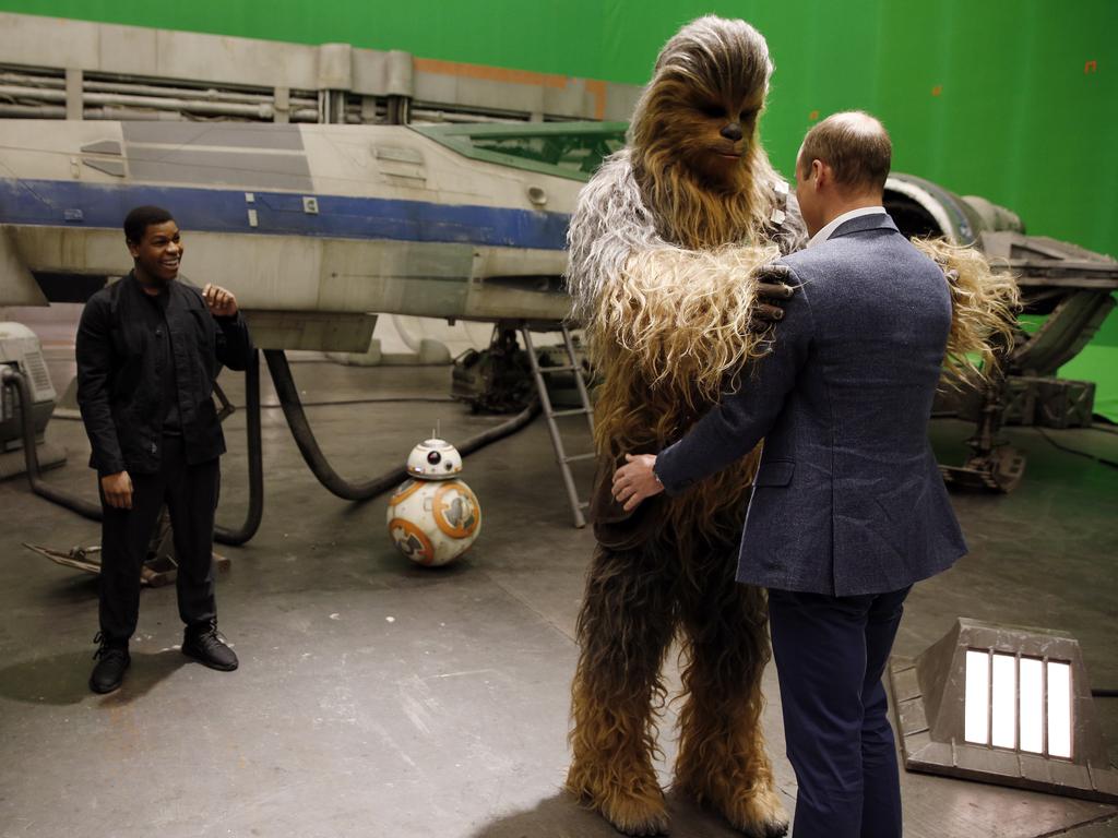 Britain’s Prince William talks with the Star Wars character Chewbacca during a tour of the Star Wars sets at Pinewood studios in Iver Heath, west of London on Tuesday April 19, 2016. Picture: AP