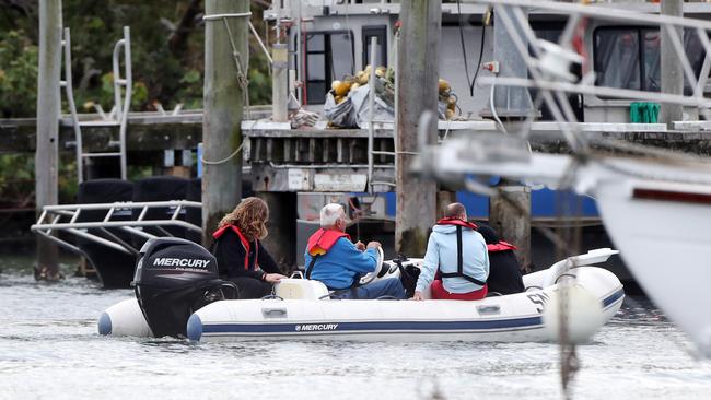 People rescued from a boat fire on the Gold Coast are brought back to shore. Picture: Nigel Hallett.