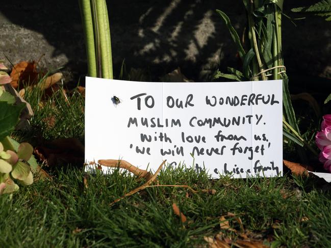 People began to place flowers at a local park in Christchurch. Picture Gary Ramage