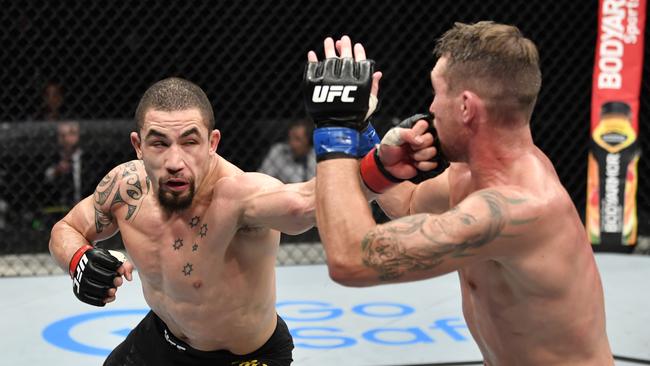 Robert Whittaker punches Darren Till during their Fight Island showdown in 2020. (Photo by Jeff Bottari/Zuffa LLC via Getty Images)