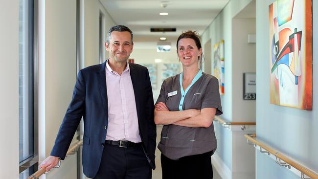 Whiddon chief executive Chris Mamarelis (left) pictured alongside an aged care worker.