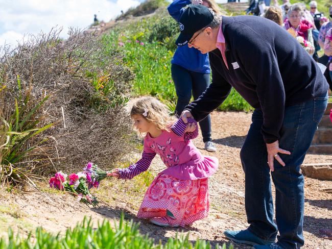 Greg Simms with Mrs Dawson's granddaughter Kiahla Walk for Lyn Dawson at Long Reef Surf Club in Sydney NSW. Lyn went missing in 1982, and her body has never been found. Sunday 30th September 2018. (AAP Image/Jordan Shields)