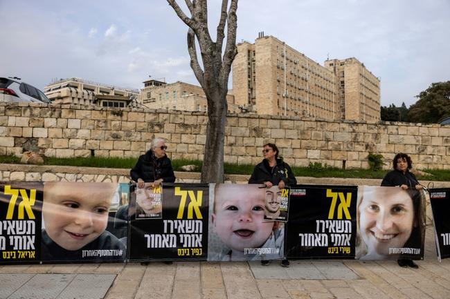 Supporters of the Israeli hostages display images of the Bibas family at a protest in front of the prime minister's office earlier this month