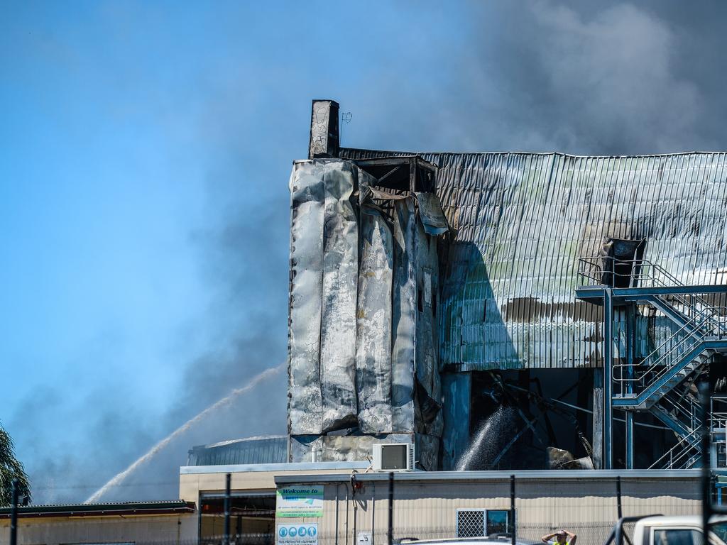 Emergency services continue to work on the huge fire at the Thomas Foods abattoir in Murray Bridge the morning after it broke out. Picture: AAP / Roy Vandervegt