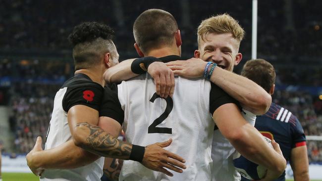 New Zealand's Dane Coles celebrates with his teammates after scoring a try against France at Stade de France Stadium.