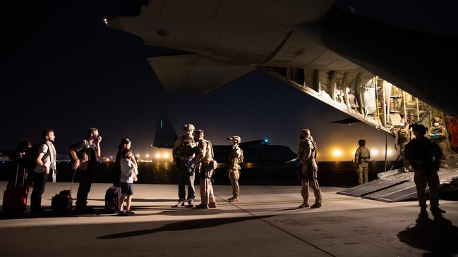 Evacuees board the C-130 Hercules at Hamid Karzai Airport. Picture: ADF