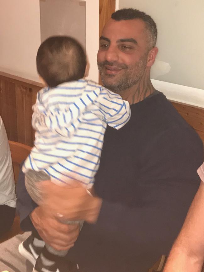 Mick Hawi holding a little person. Picture: Supplied