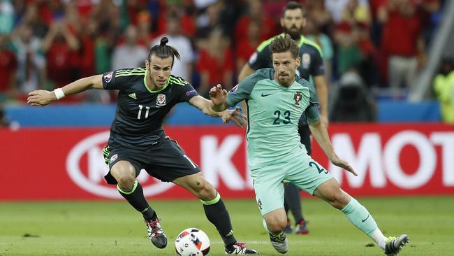 Wales' Gareth Bale, left, and Portugal's Adrien Silva both in green for the Euro semi-final.