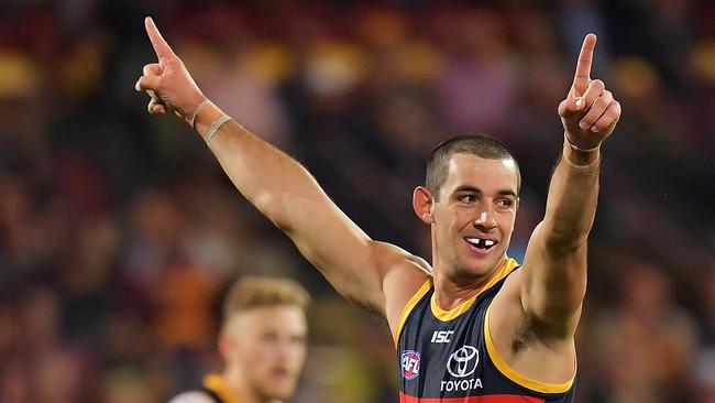 Crows captain Taylor Walker celebrates after kicking a goal against Richmond on Thursday night. Picture: Daniel Kalisz/Getty Images