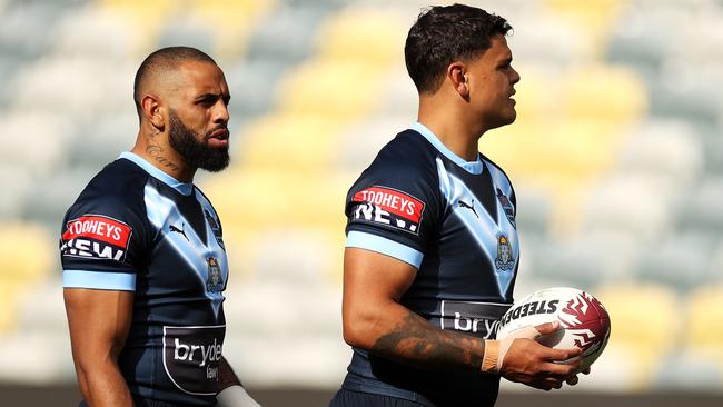 Josh Addo-Carr gestures to Latrell Mitchell during training at Queensland Country Bank Stadium. Picture: Mark Kolbe/Getty Images