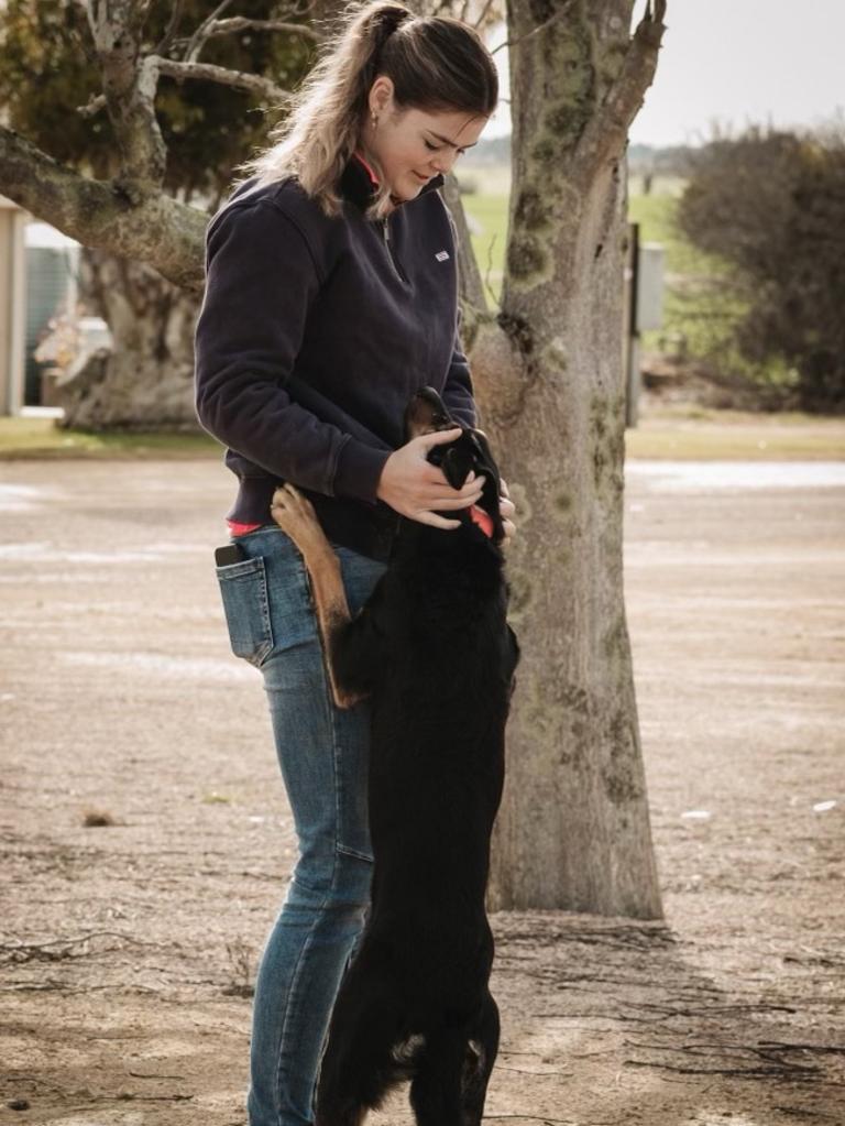 Poppy Crozier with one of working dogs on the family farm. Picture: Sarah Cunningham