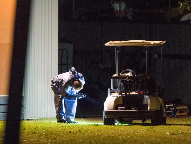 Police search a house where Darren Thornburgh’s body was found. Picture: Mark Stewart