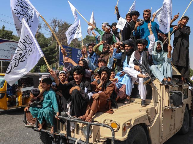 TOPSHOT - A convoy of Taliban security personnel seen moving along the streets as they celebrate the third anniversary of Taliban takeover of Afghanistan, in Herat on August 14, 2024. Taliban authorities kicked off celebrations of the third anniversary of their rule over Afghanistan on August 14 at the former US Bagram air base. (Photo by Mohsen KARIMI / AFP)