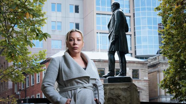 Nala Mansell at the contentious statue of William Crowther, in Franklin Square in Hobart. Picture: Peter Mathew