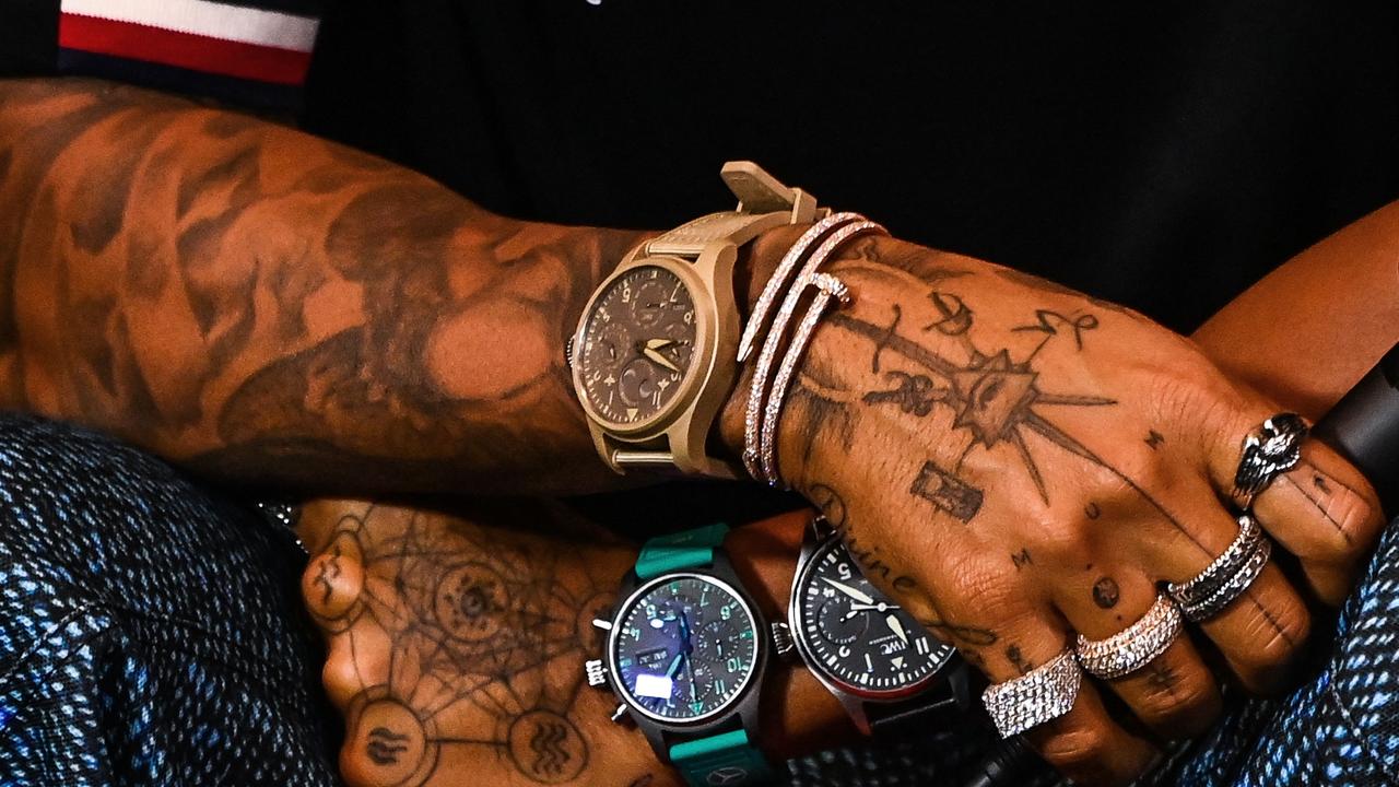 Three watches, three different times? The sacrifices you make for fashion. Photo: Chandan Khanna/AFP