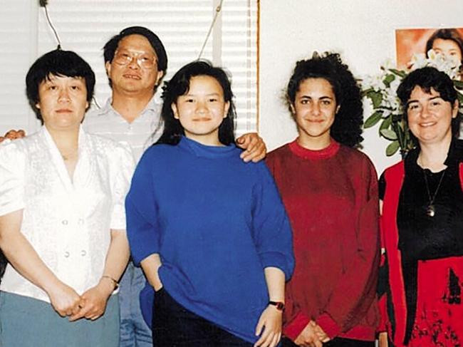 Seeking a new life … Cheng Lei (centre) with her parents (left) and friends just before moving from Melbourne to Queensland in 1990. The family had been together in Australia for five years. Photo courtesy of Cheng Lei.
