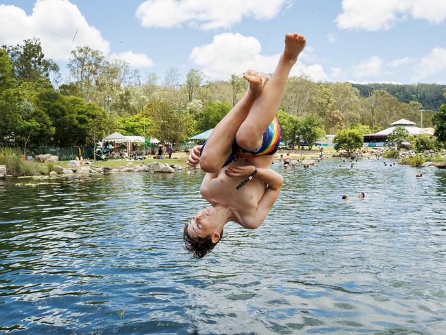 10 year old Ash Wilson from Sydney cools off at Lake Gkula on the opening day of the 2023 Woodford Folk Festival. Picture Lachie Millard