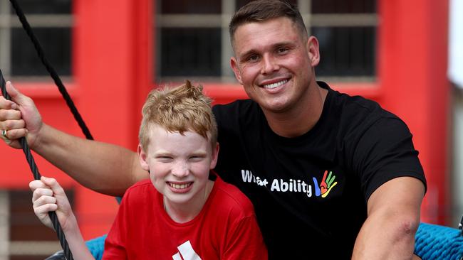 Former Parramatta Eels player Steve Dresler, with Owen, a What Ability participant. Picture: Toby Zerna