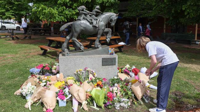 By mid-afternoon on Monday, dozens and dozens of floral tributes had been laid. Picture: Brendan Beckett