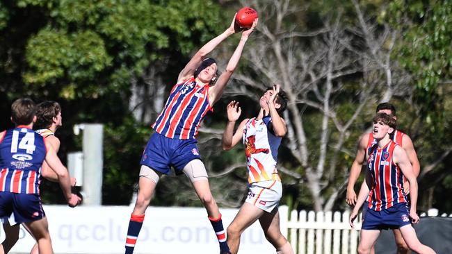 Wilston Grange player Aston Wilson of Padua reaches for a mark. Picture, John Gass