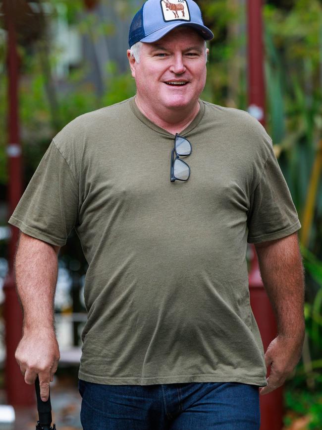 The former cricketer left Crumbs cafe near his home in Cremorne on the Lower North Shore with a man who was seen taking notes. Picture: Justin Lloyd.