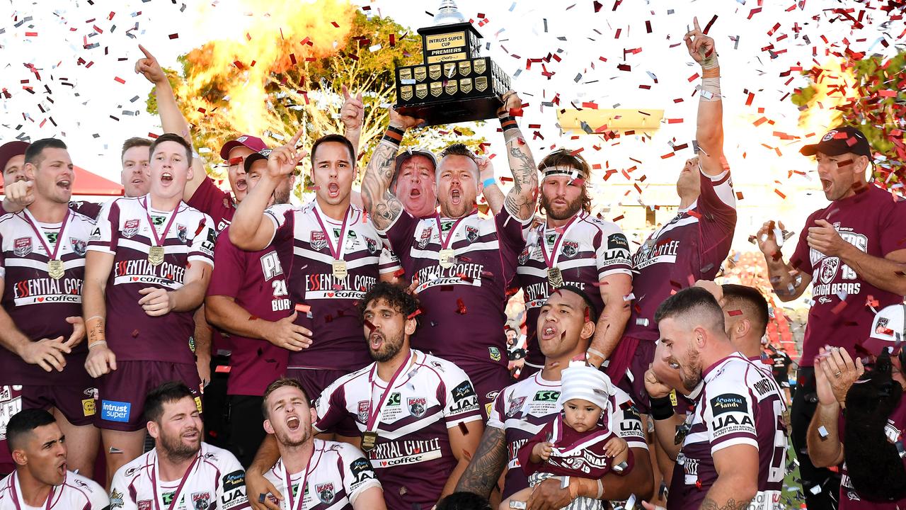 Burleigh Bears players celebrate the win with captain Luke Page holding the cup aloft. Intrust Super Cup grand final between Wynnum Manly Seagulls and Burleigh Bears. Sunday September 29, 2019. (AAP image, John Gass)