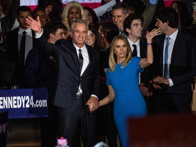 Robert F Kennedy Jr., with his wife Cheryl Hines, waves to supporters during a campaign event to launch his 2024 presidential bid, at the Boston Park Plaza in Boston, Massachusetts, on April 19, 2023. (Photo by JOSEPH PREZIOSO / AFP)